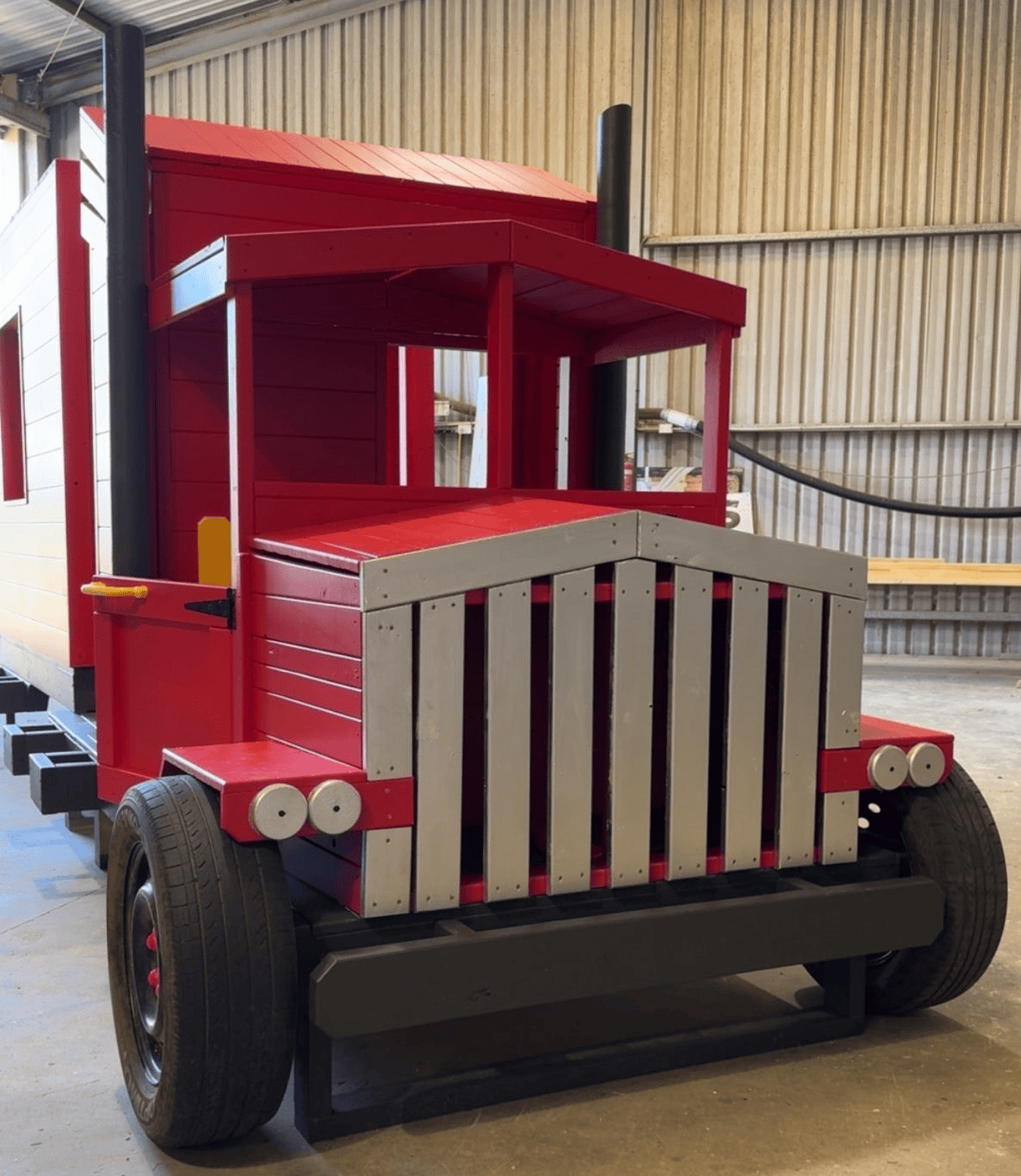 Photo of updated Truck produced February 2026. Customer requested red with touches of yellow.